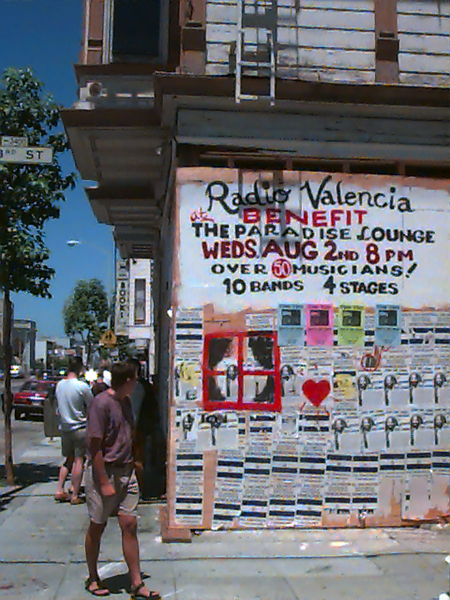 Announcement of a benefit for Radio Valencia painted on the boarded up windows